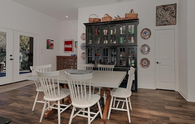 dining space featuring french doors and dark hardwood / wood-style floors