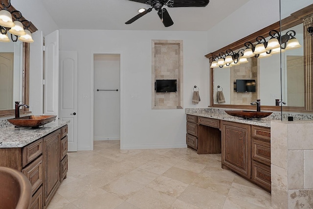 bathroom with ceiling fan and vanity