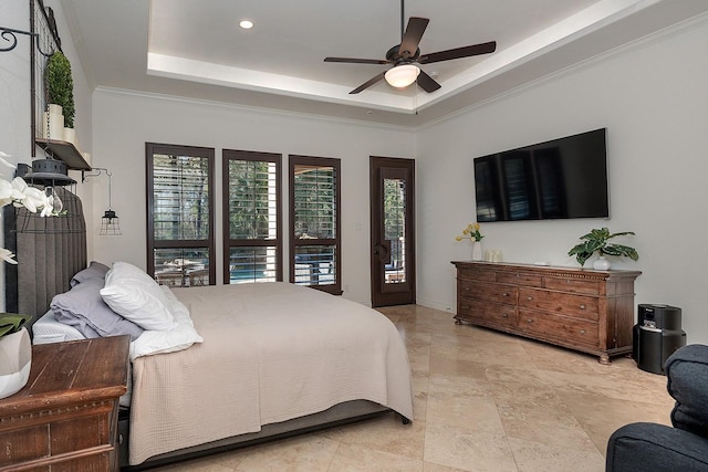 bedroom featuring crown molding, ceiling fan, and a tray ceiling