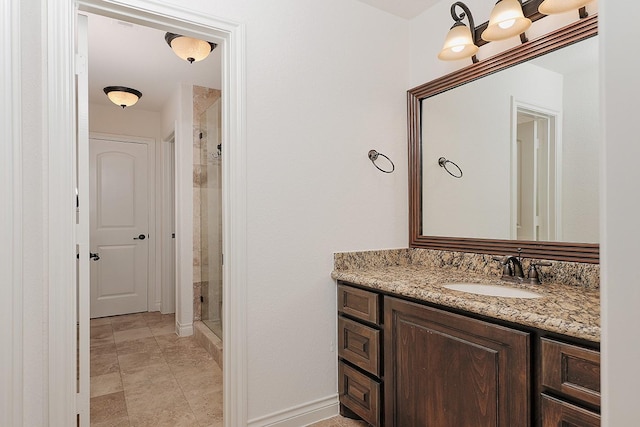 bathroom with vanity and a shower with shower door