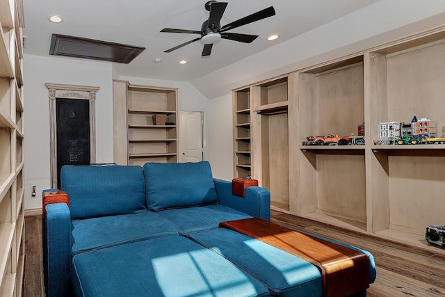 living room featuring vaulted ceiling, ceiling fan, and hardwood / wood-style floors