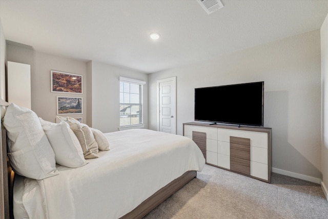 bedroom with light colored carpet