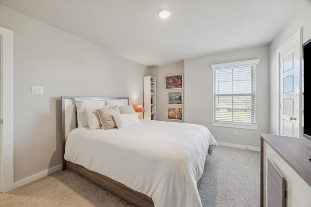 bedroom with light colored carpet