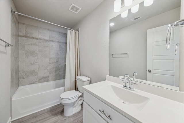 full bathroom with shower / bathtub combination with curtain, vanity, wood-type flooring, and toilet