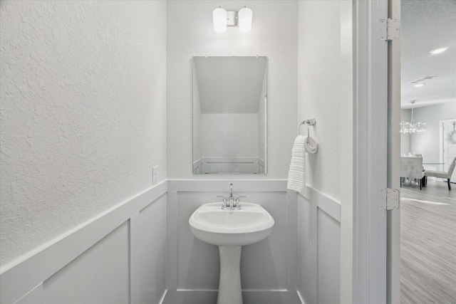 bathroom with hardwood / wood-style flooring