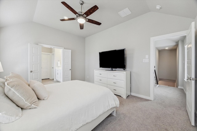 carpeted bedroom with lofted ceiling, connected bathroom, and ceiling fan