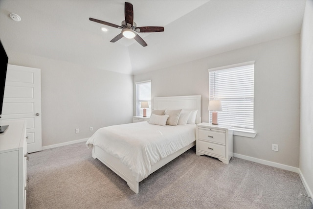 carpeted bedroom featuring ceiling fan and vaulted ceiling