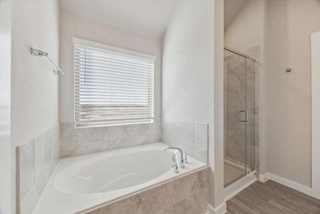 bathroom with wood-type flooring and separate shower and tub