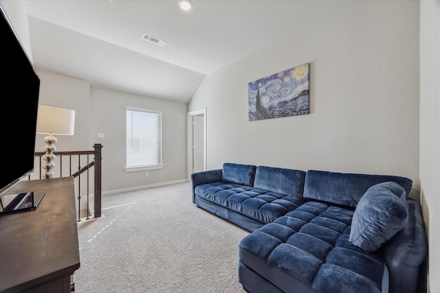 carpeted living room with lofted ceiling