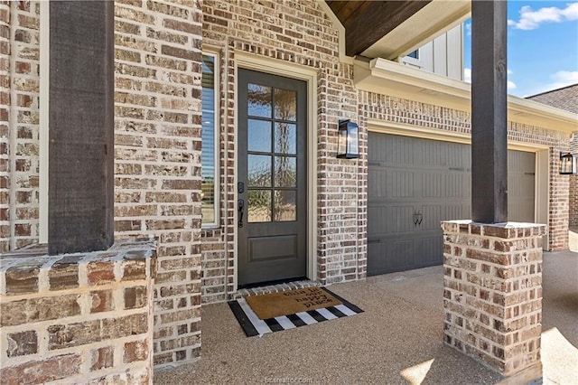 view of exterior entry featuring a garage