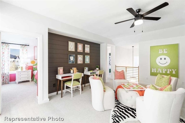 carpeted living room featuring ceiling fan