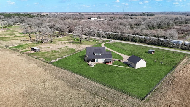 birds eye view of property featuring a rural view