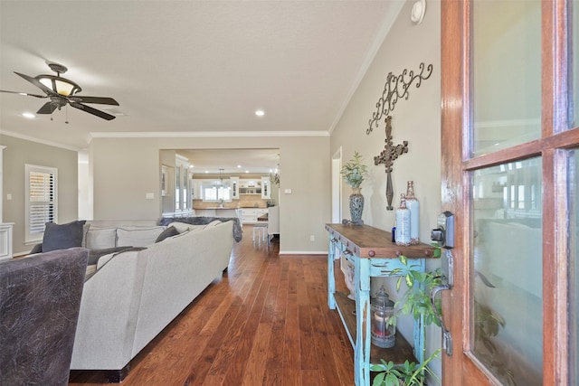 living room featuring crown molding, dark wood-type flooring, and ceiling fan