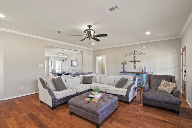 living room with crown molding, ceiling fan with notable chandelier, and dark hardwood / wood-style floors