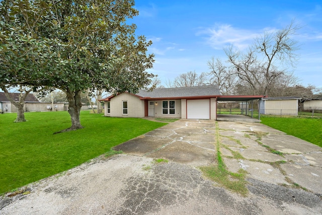 ranch-style house featuring a garage and a front yard