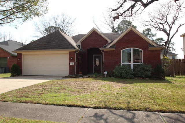 view of front of home featuring a garage and a front lawn