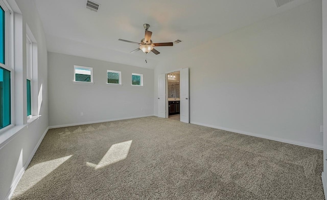 carpeted empty room featuring ceiling fan