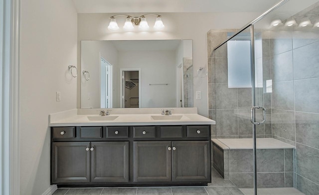 bathroom featuring vanity and a shower with shower door