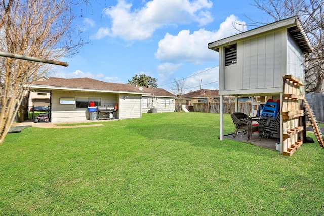 view of yard with a playground and a patio area