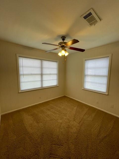 empty room with carpet floors and ceiling fan