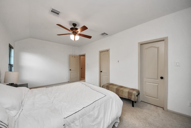 carpeted bedroom with lofted ceiling and ceiling fan