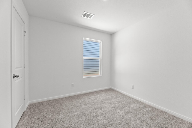 spare room featuring carpet flooring