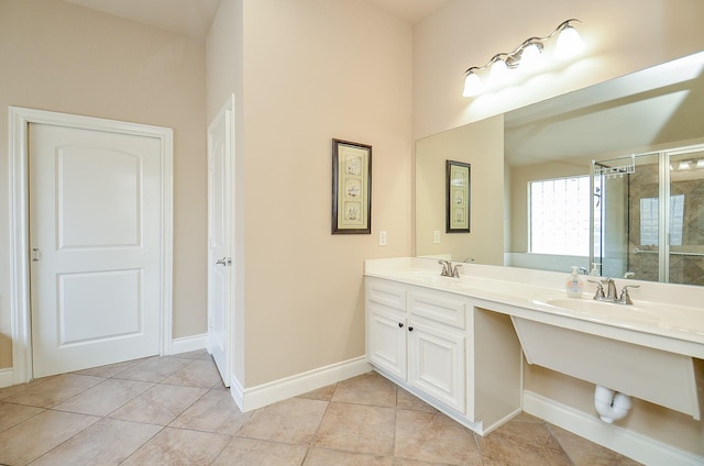 bathroom featuring vanity, tile patterned floors, and walk in shower