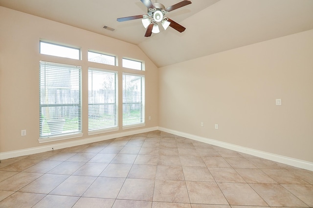 tiled spare room with lofted ceiling and ceiling fan