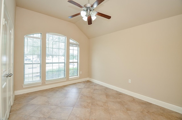 spare room featuring ceiling fan and lofted ceiling