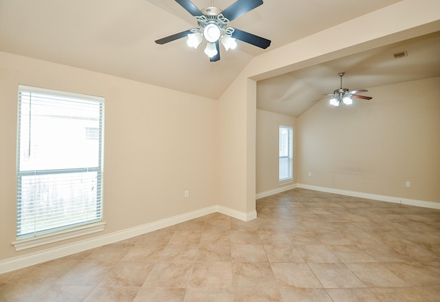 empty room featuring ceiling fan and vaulted ceiling