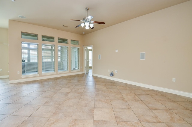 spare room with light tile patterned floors and ceiling fan