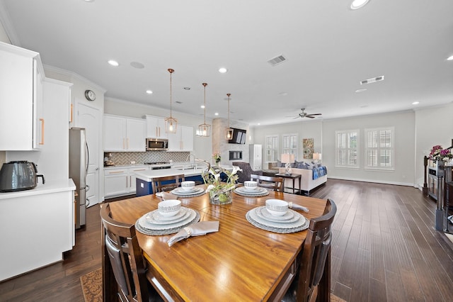 10812 Kyler Oaks Pl, Houston, TX 77043 - dining room with ceiling fan, recessed lighting, and dark wood-type flooring