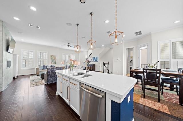 10812 Kyler Oaks Pl, Houston, TX 77043 - kitchen featuring stainless steel dishwasher, open floor plan, recessed lighting, dark wood-style floors, and light countertops