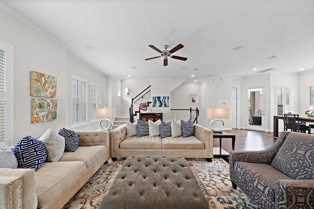 10812 Kyler Oaks Pl, Houston, TX 77043 - living room featuring ornamental molding, wood finished floors, stairway, plenty of natural light, and ceiling fan