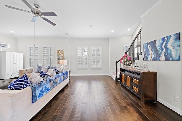 living room with crown molding, ceiling fan, dark hardwood / wood-style floors, and a wealth of natural light