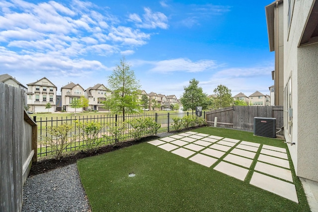 10812 Kyler Oaks Pl, Houston, TX 77043 - view of yard featuring a residential view, central AC, and a patio area