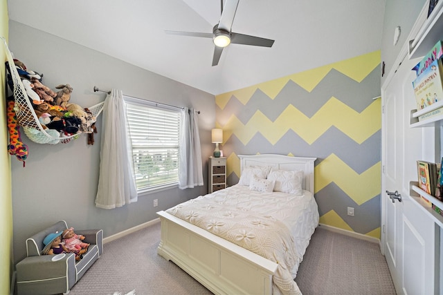 carpeted bedroom with ceiling fan and lofted ceiling