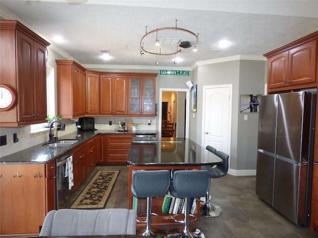 kitchen featuring tasteful backsplash, sink, a center island, stainless steel appliances, and crown molding