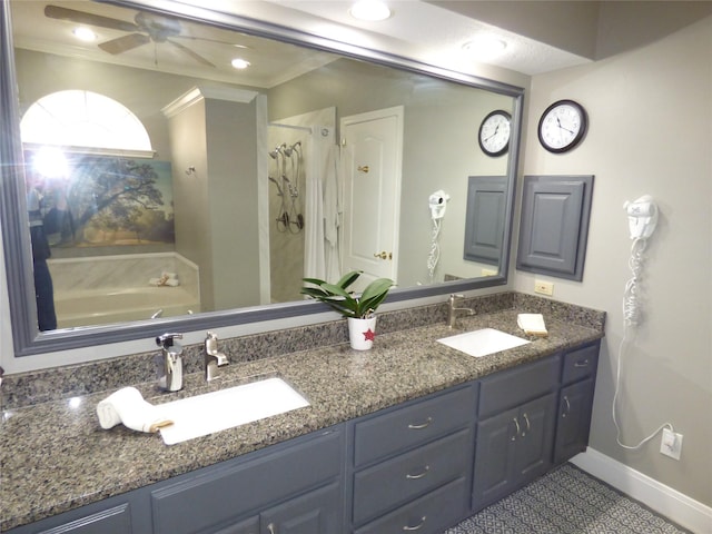 bathroom with crown molding, ceiling fan, vanity, and a washtub