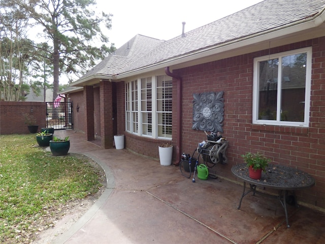 view of side of home with a patio area