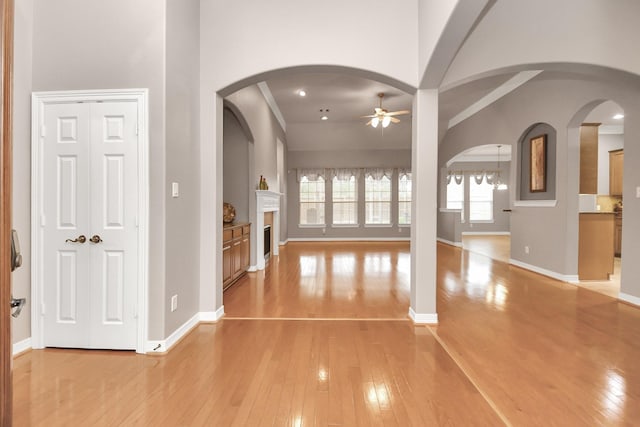 interior space with ceiling fan and light hardwood / wood-style flooring