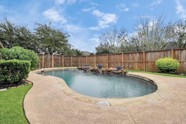 view of swimming pool featuring a fenced backyard