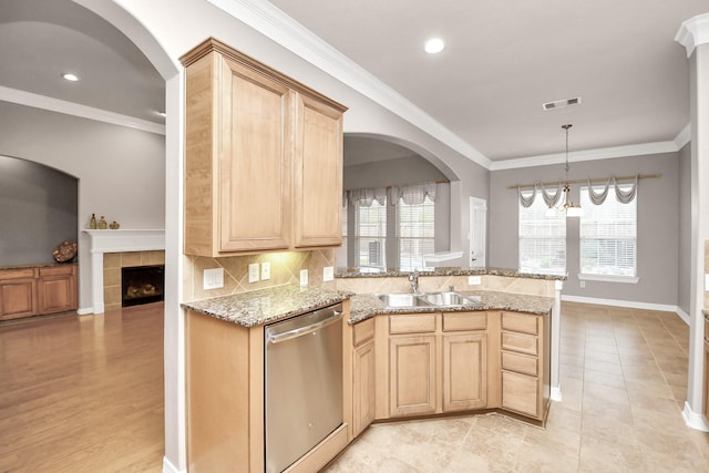 kitchen with ornamental molding, dishwasher, sink, and light brown cabinets