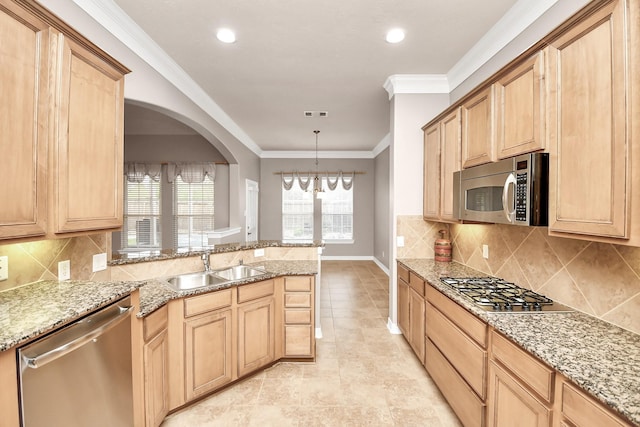 kitchen featuring pendant lighting, sink, crown molding, appliances with stainless steel finishes, and light brown cabinets