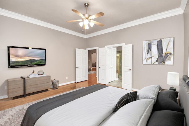 bedroom featuring connected bathroom, ornamental molding, and light wood-type flooring