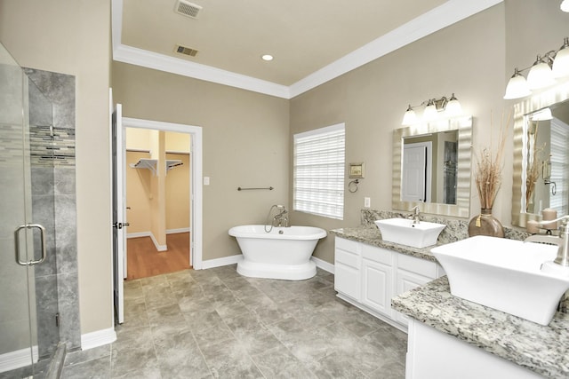 bathroom with vanity, ornamental molding, and independent shower and bath