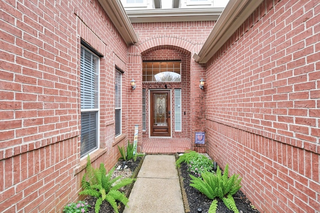 entrance to property with brick siding