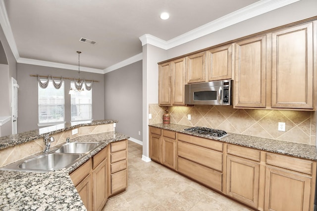 kitchen featuring sink, decorative light fixtures, ornamental molding, stainless steel appliances, and backsplash