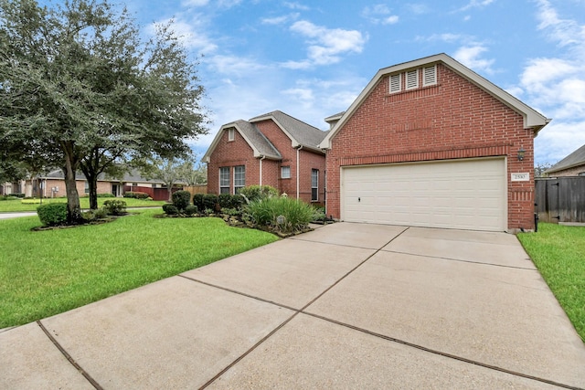 view of property featuring a garage and a front yard