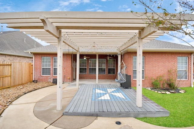 view of patio / terrace with ceiling fan and a pergola